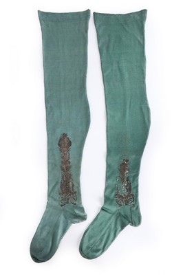 Lot 103 - A pair of teal silk stockings, early 18th...