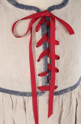 Lot 174 - A rare Paul Poiret child's dress, circa 1922,...