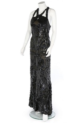 Lot 188 - An ornately sequinned black evening gown,...