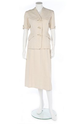 Lot 196 - A rare Hermès white linen summer suit, late...