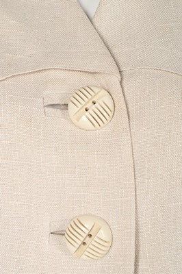 Lot 196 - A rare Hermès white linen summer suit, late...