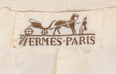 Lot 196 - A rare Hermès white linen summer suit, late...