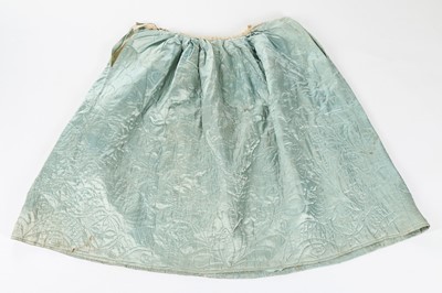 Lot 300 - A pale blue quilted silk petticoat, second...