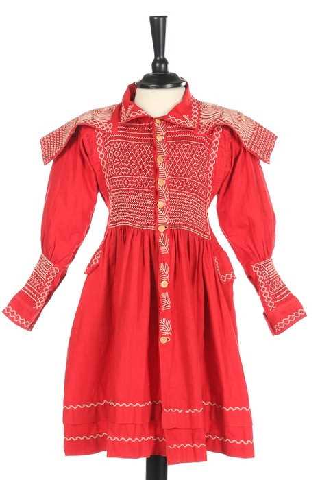 Lot 145 - A child's scarlet linen farmer's smock, circa...