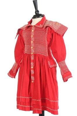 Lot 145 - A child's scarlet linen farmer's smock, circa...