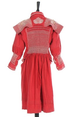 Lot 145 - A child's scarlet linen farmer's smock, circa...