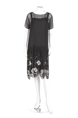 Lot 25 - Two black beaded flapper dresses, late 1920s,...