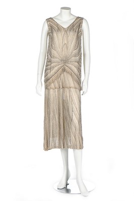 Lot 50 - A couture beaded nude chiffon flapper dress,...