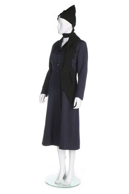 Lot 293 - A Schiaparelli couture navy wool day coat,...