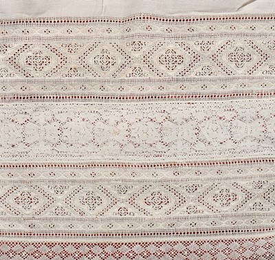 Lot 389 - A reticella and bobbin lace edged apron,...