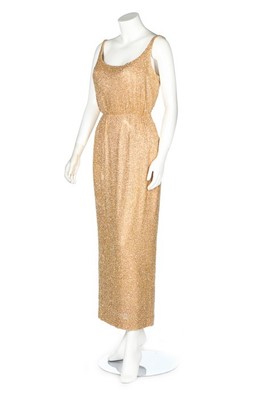 Lot 64 - A Douglas Darnell gold beaded evening ensemble,...