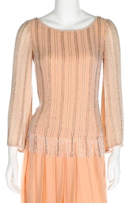 Lot 204 - A Chanel couture beaded pale peach chiffon...