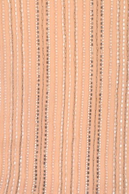 Lot 204 - A Chanel couture beaded pale peach chiffon...
