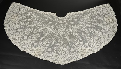 Lot 394 - A net on net lace cape, circa 1860, the tulle...