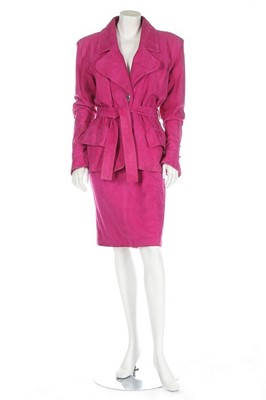 Lot 131 - An Yves Saint Laurent hot pink suede suit and...