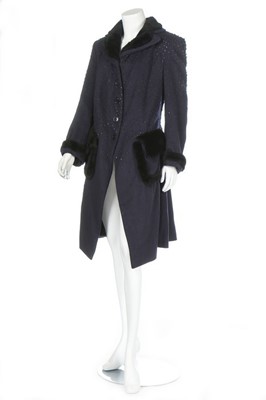 Lot 190 - A John Galliano navy wool and faux fur coat,...