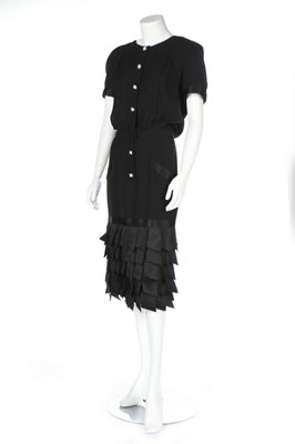 Lot 214 - A Chanel boutique black cocktail dress, 1990s,...