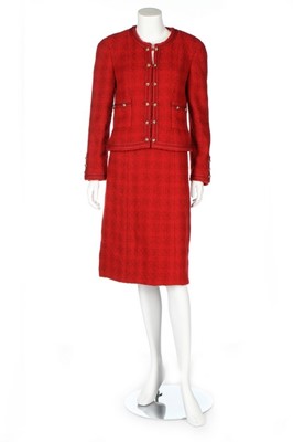 Lot 291 - A Chanel red bouclé wool suit, 1990s, Boutique...