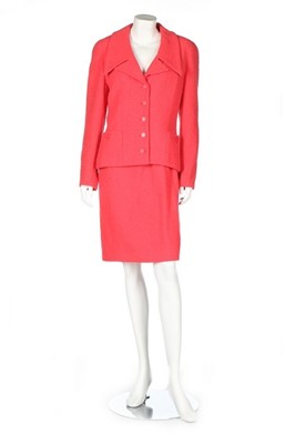 Lot 292 - A Chanel hot-pink bouclé wool suit, 1994,...