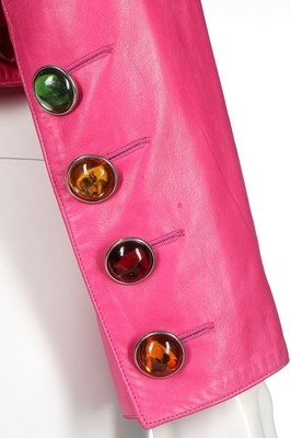 Lot 318 - An Yves Saint Laurent hot-pink 'gem' adorned...