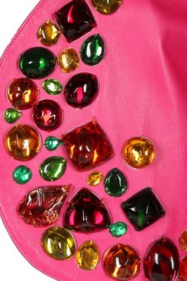 Lot 318 - An Yves Saint Laurent hot-pink 'gem' adorned...