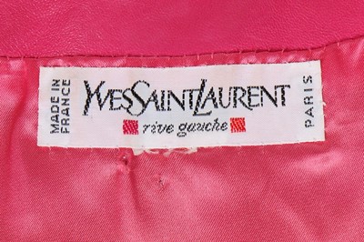 Lot 318 - An Yves Saint Laurent hot-pink 'gem' adorned...