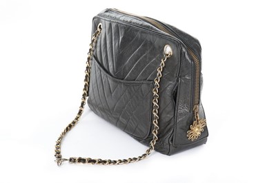 Lot 151 - A Chanel black chevron-quilted leather handbag,...