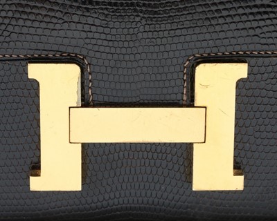 Lot 2 - An Hermès dark brown lizard 'Constance' bag,...