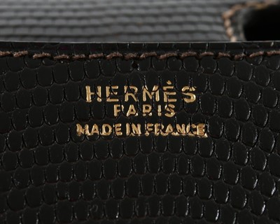 Lot 2 - An Hermès dark brown lizard 'Constance' bag,...