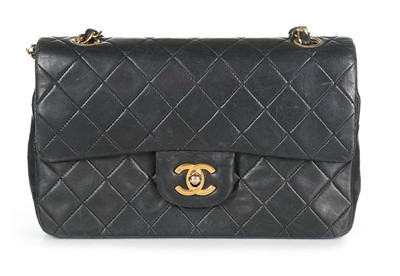 Lot 239 - A Chanel black quilted leather 2.55 bag, 1980s-...