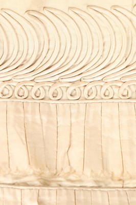 Lot 250 - An ivory silk evening dress, circa 1820,...