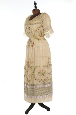 Lot 144 - An embroidered muslin dress, circa 1914-18,...