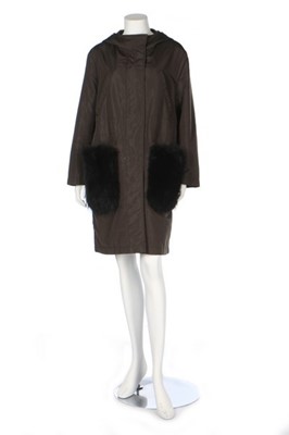 Lot 301 - A Prada parka with black racoon fur pockets,...