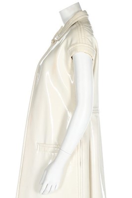 Lot 168 - A Courrèges couture ivory vinyl maxi ensemble,...