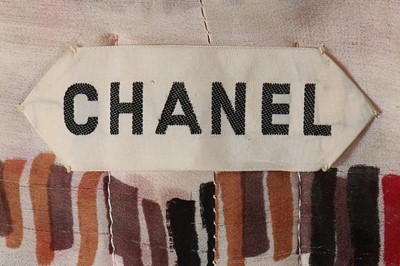 Lot 203 - A Chanel couture tweed suit, Spring-Summer,...