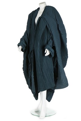 Lot 231 - A Romeo Gigli peacock-blue pleated cocoon coat,...