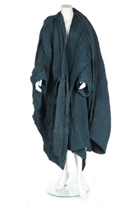 Lot 231 - A Romeo Gigli peacock-blue pleated cocoon coat,...