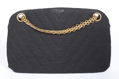 Lot 6 - A Chanel chevron quilted black jersey handbag,...