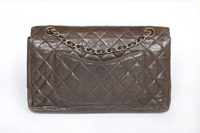 Lot 7 - A Chanel quilted brown leather flap bag, 1960s,...