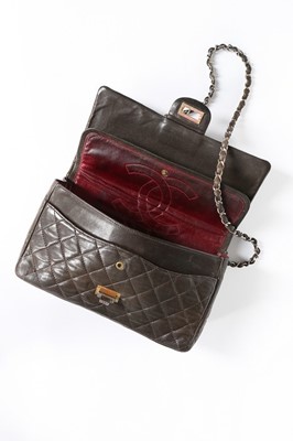 Lot 7 - A Chanel quilted brown leather flap bag, 1960s,...