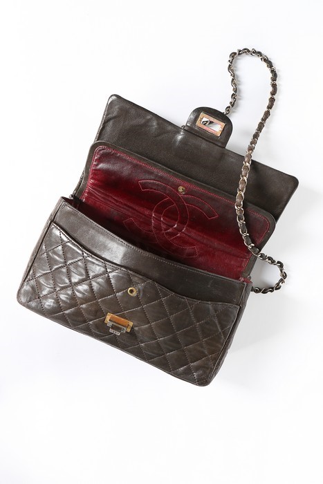 Lot 7 - A Chanel quilted brown leather flap bag, 1960s