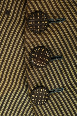 Lot 38 - A young man's striped black and yellow silk...