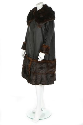 Lot 58 - A rare and early Gabrielle Chanel black satin...
