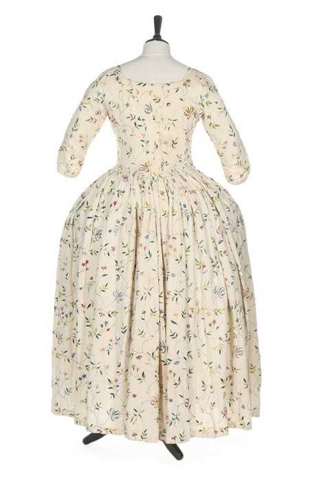 Lot 40 - An embroidered linen open robe, English,
