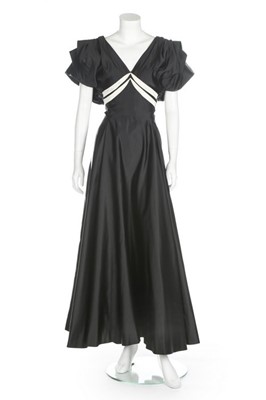 Lot 66 - A black and white satin bias cut evening gown,...