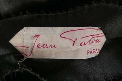 Lot 100 - A Jean Patou couture black satin trapunto...