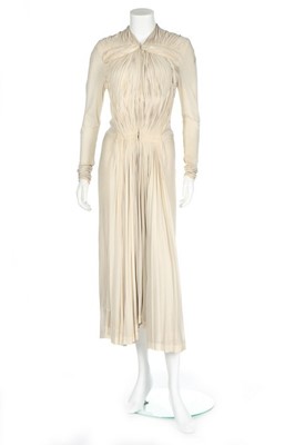 Lot 111 - A Madame Grès ivory silk jersey dinner dress,...