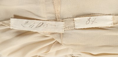 Lot 111 - A Madame Grès ivory silk jersey dinner dress,...