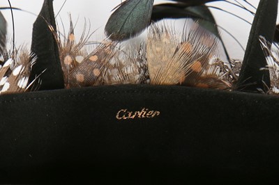 Lot 5 - An unusual Cartier suede and feather evening...