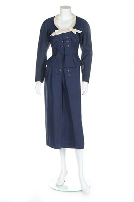 Lot 124 - A Jacques Fath couture navy wool day suit,...